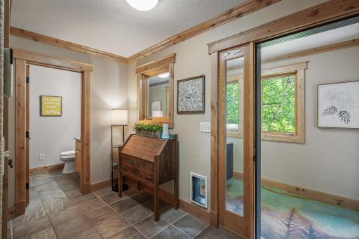 Hallway from the kitchen to the 3/4 bath and breezeway. Large closet also contains laundry hookup.