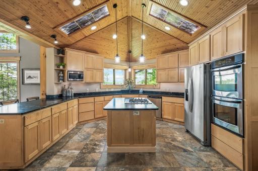 The kitchen boasts beautiful lake views and access to the large backyard patio.