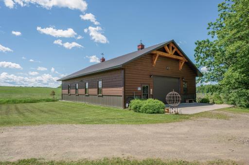 Extra large 40âx60â matching insulated outbuilding that includes a 20x30 heated shop with electrical and water available.