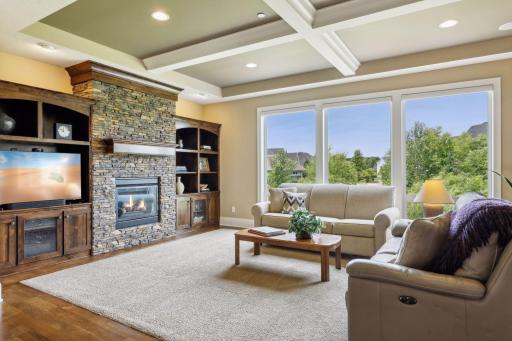 Living Room with 2-way gas fireplace into the Sun Room