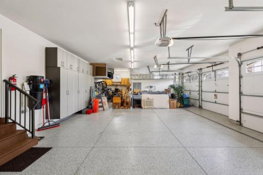 Enormous 4-car heated garage with epoxy flooring