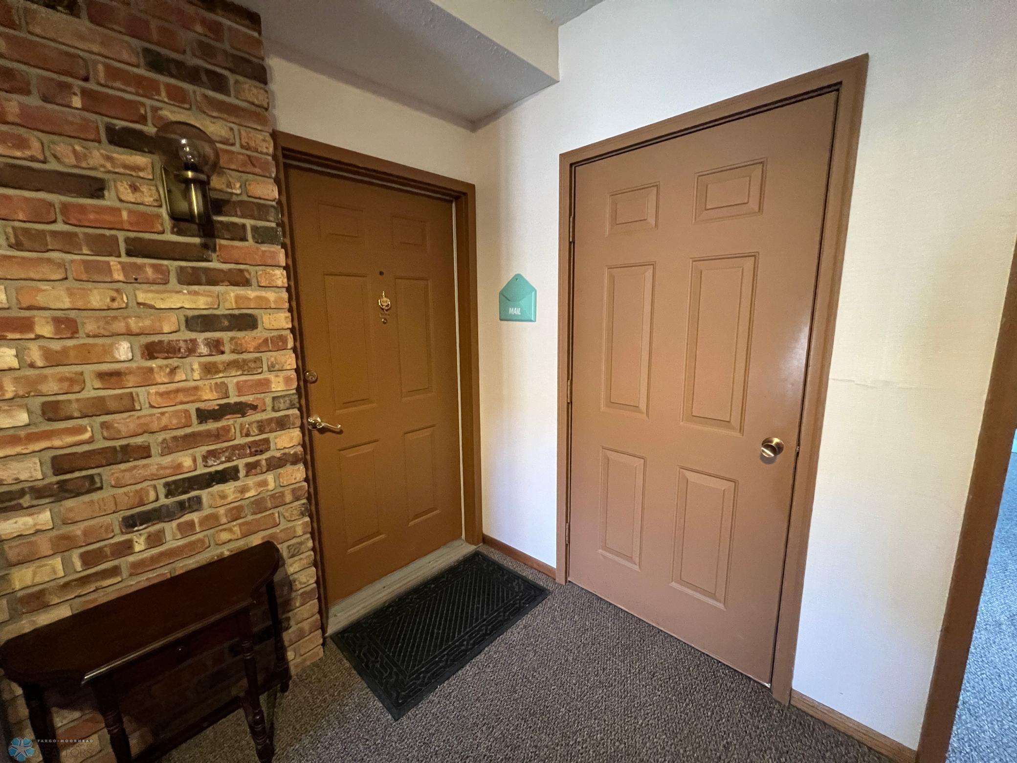 Front door and door to basement storage