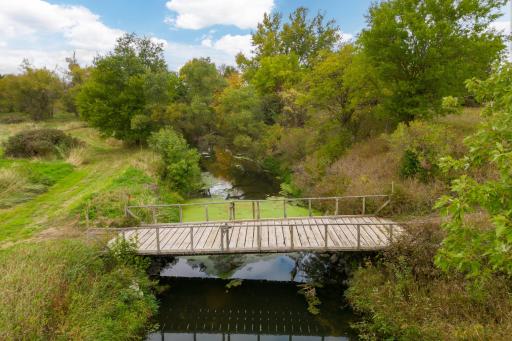 154 acres - including wooded, high ground, pasture, creek, pond, and 5 miles of trails