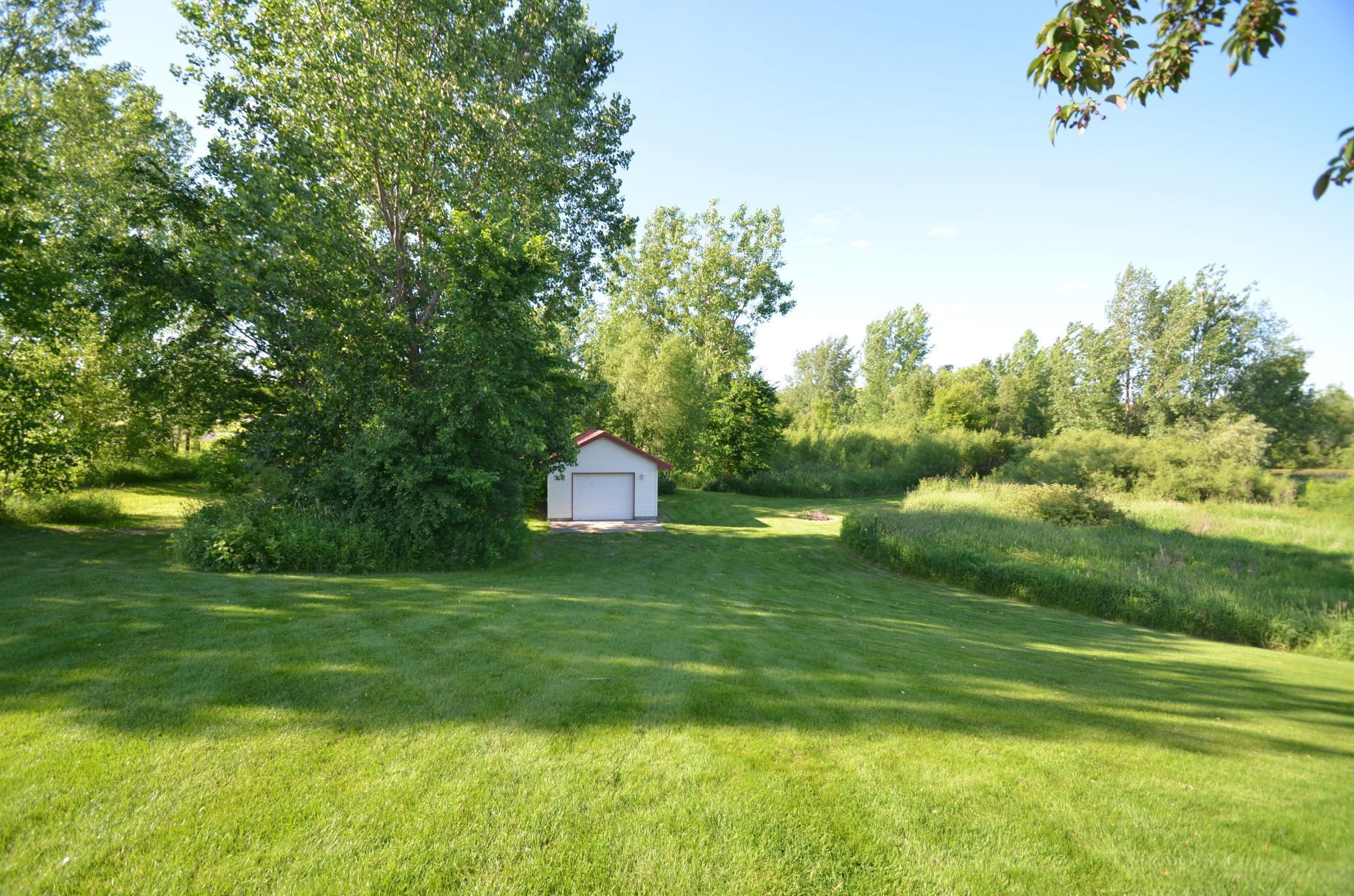 To the left of the bonus garage is a great spot to add an outbuilding. 28x64 with 14' sidewalls outbuilding previously approved by city.