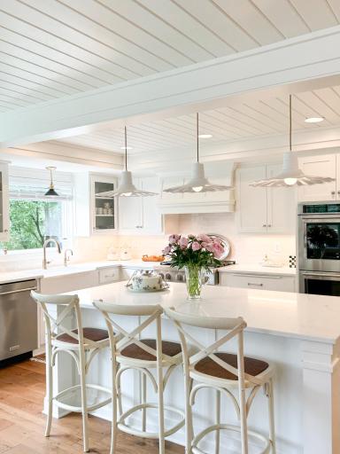 The home was expanded to include the new chef's kitchen with custom cabinetry, quartz countertops, butlers pantry, and high-end appliance package.