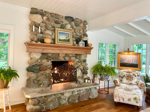The substantial fieldstone fireplace is a focal point of the living room and offers a gas log set for easy use..