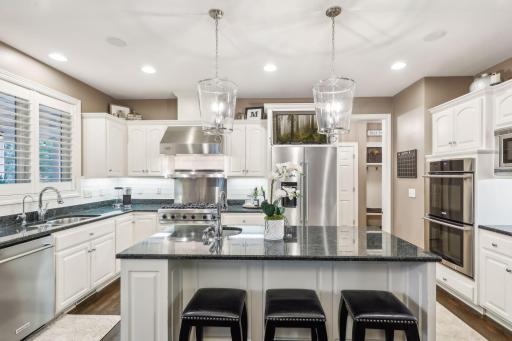Equipped with top-of-the-line appliances, including double ovens and a Viking Professional gas range, this kitchen is designed to meet the needs of even the most discerning chef.