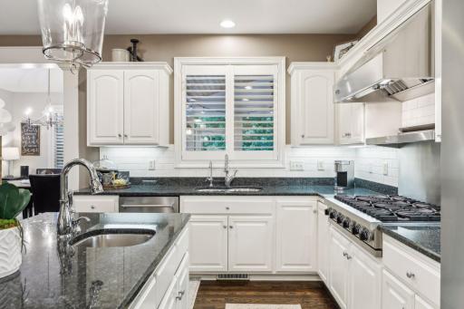 Adding to the kitchen’s charm are the plantation shutters that lend a touch of classic elegance while allowing you to control light and privacy.