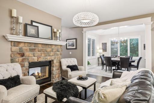 The sitting room’s strategic location makes it a versatile area, seamlessly connecting the hustle and bustle of the kitchen with the serene ambiance of the sunroom.