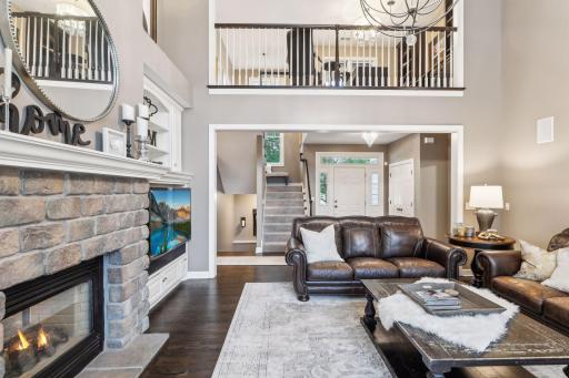 A gas fireplace, nestled amidst custom built-ins, provides both functionality and style.
