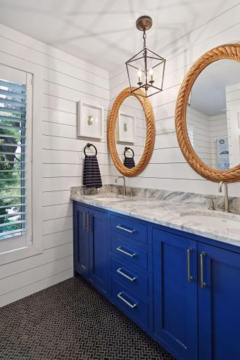 This nautical-themed hall bath is done to perfection! Heated floors!
