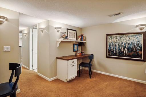 Two built-in desks with shelves offer the perfect homework spot or home office.