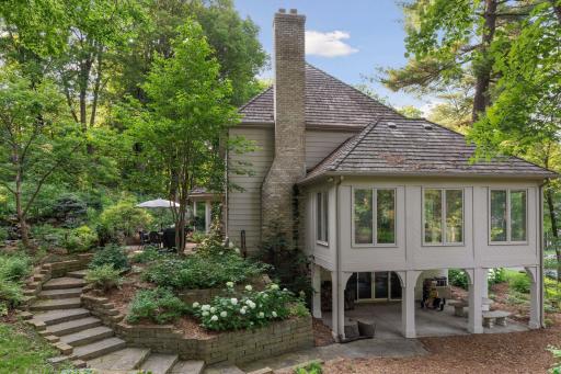 This yard offers ample spaces to enjoy and entertain.