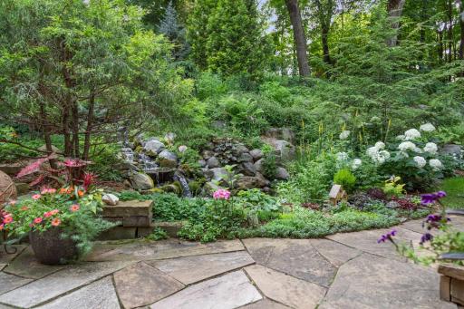 Stunning gardens and landscaping surround the Koi pond and waterfall.