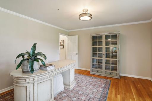 The formal dining room is currently used as a home office.