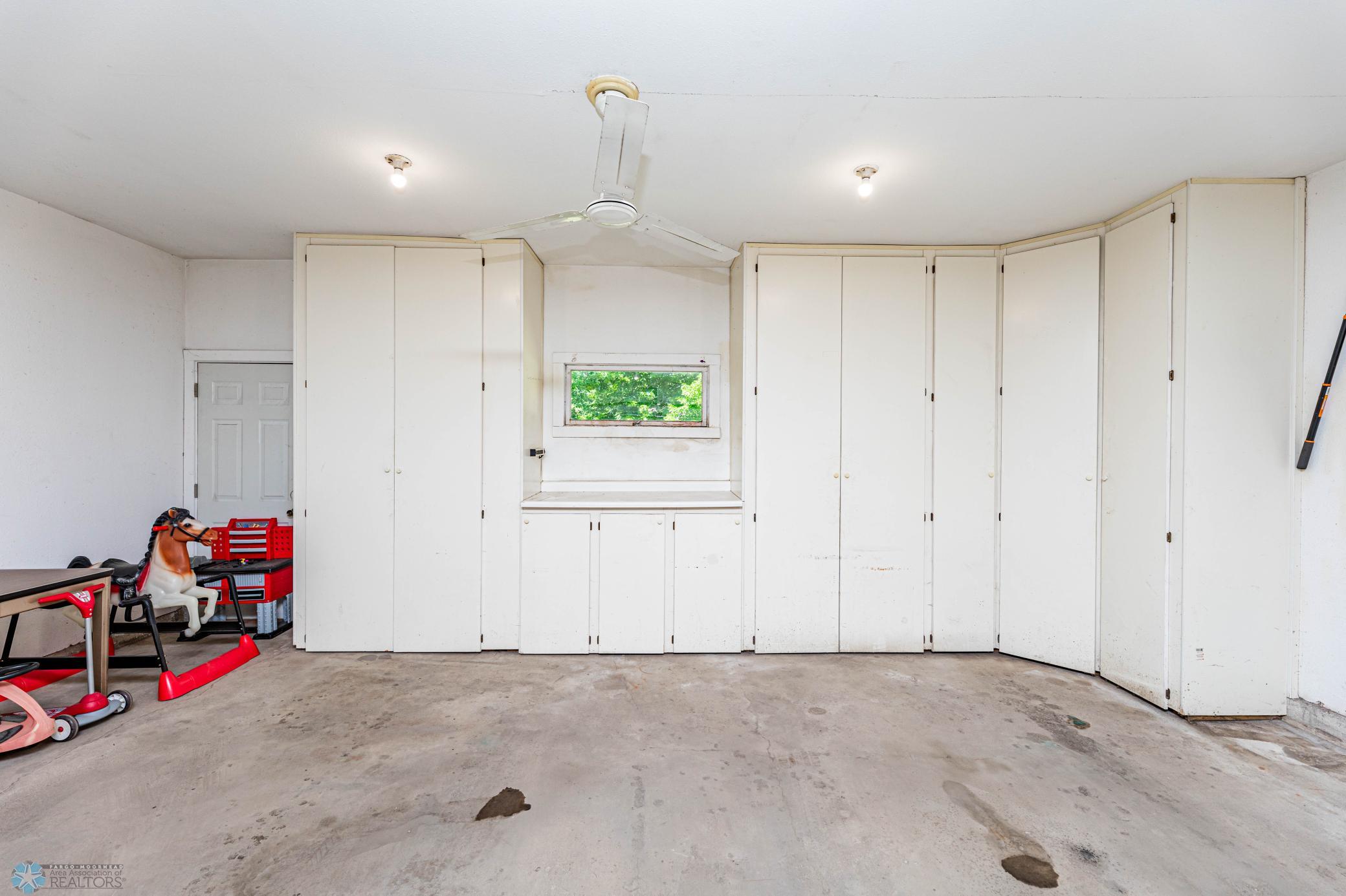 Finished Garage Plenty of Storage Cabinets
