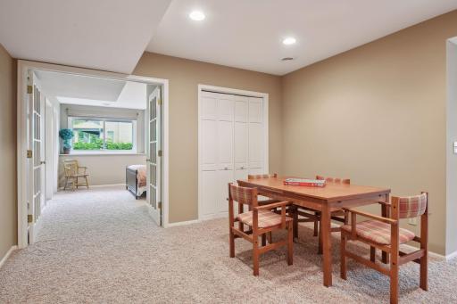 Lower level family room w/ french doors opening to 5th bedroom
