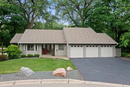 Nestled in a quiet neighborhood on a cul-de-sac and a wooded lot, this charming rambler offers a serene oasis near the city.