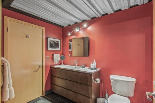 Bathroom has been fully renovated as well, with natural slate tile floors and custom tile accents
