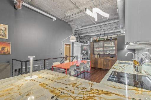 The huge eat-in kitchen is the heart of this loft, beautifully renovated with custom details and high-end materials