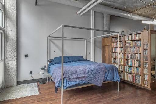 Spacious bedroom includes built-in bookcases
