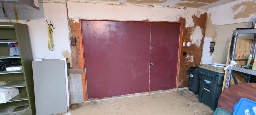 So, the left half of this door swings up, allowing the entire space to be opened. Seller was able to get his boat into the mechanical room behind this door to work on it when he wanted to