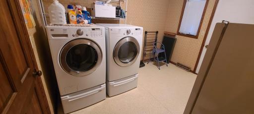Right next to the kitchen, we have a nice sized laundry room. Appliances here are staying with the house as well