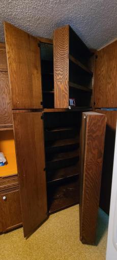 Upper and lower shelves of the pantry open out, making room for so much more storage space.