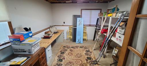 Office/storage area in lower level. With large windows to let in plenty of light