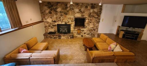 With a sunken sitting area around the wood burning stove