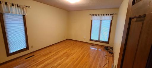 Second main floor bedroom, with beautiful hardwood floors