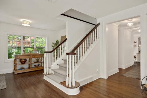 An elegant stairwell located off the foyer leads to the four, well appointed upper level bedrooms.