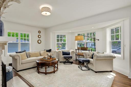 The formal living area features an abundance of natural light through these gorgeous windows.