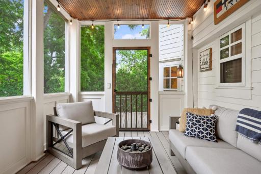 Wainscoting side wall with screens offer a wonderful space to relax and enjoy the outdoors.