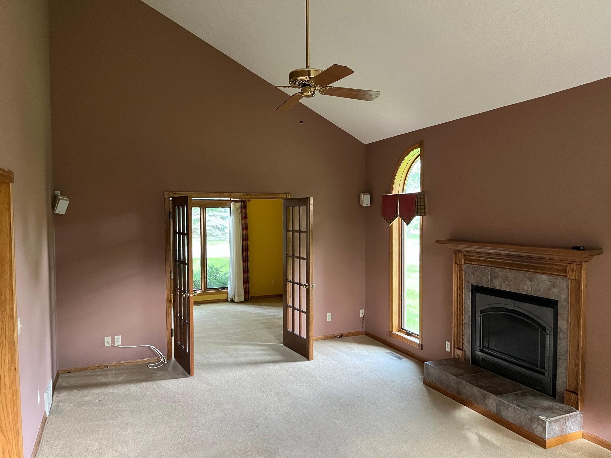 Living room with gas insert and vaulted ceiling