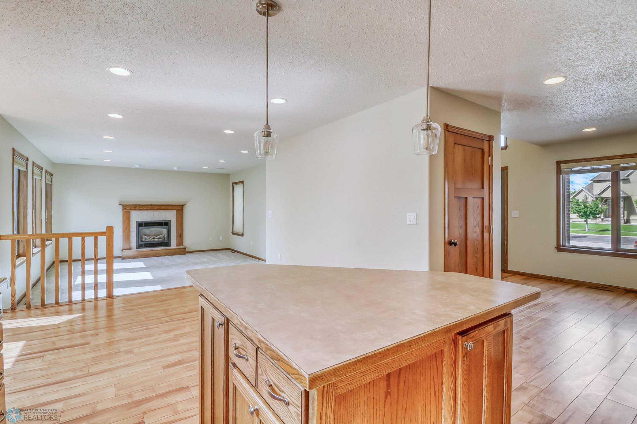 Kitchen - looking (left) towards dining room, and (right) towards entry