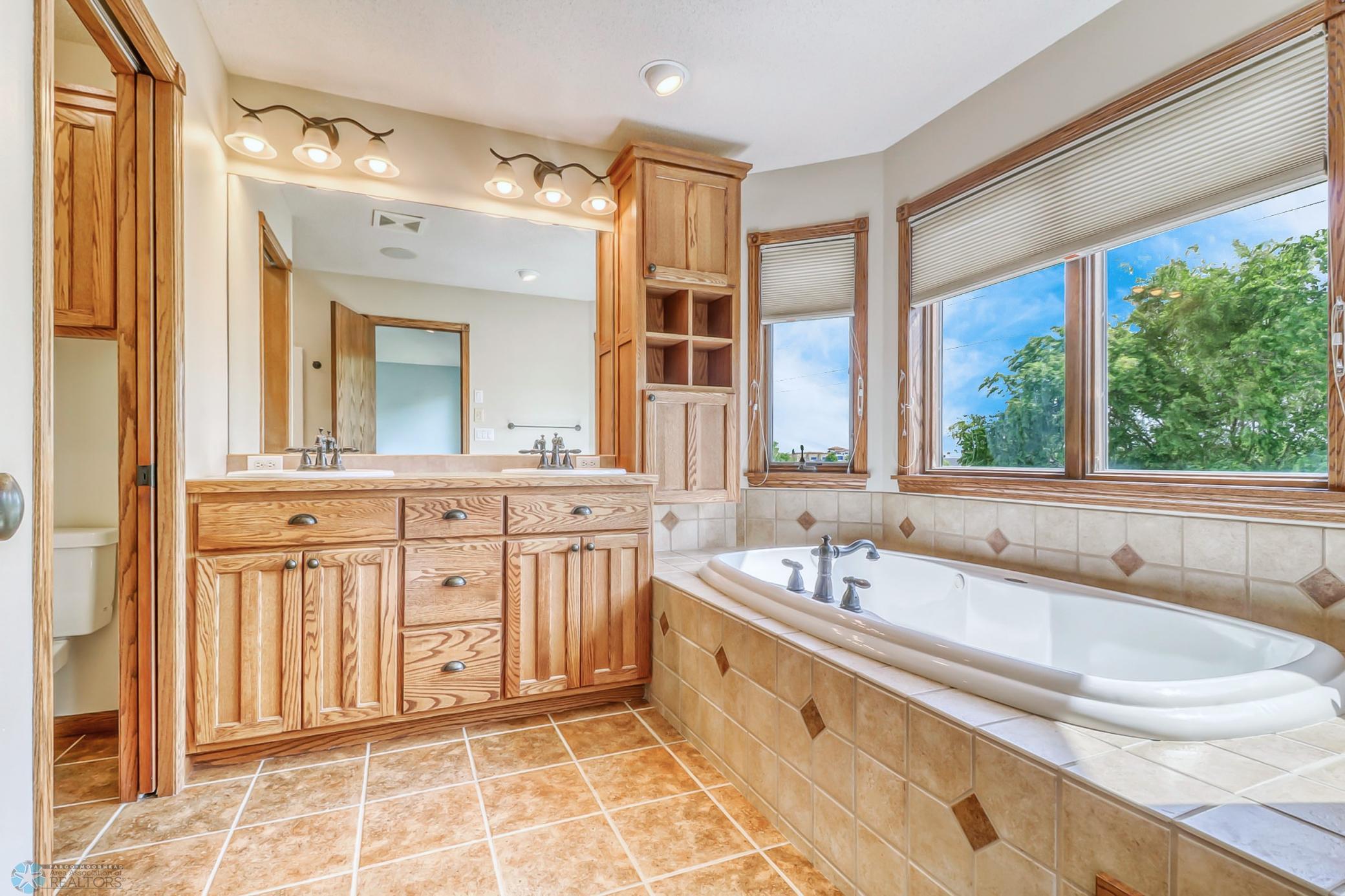 Primary Bathroom - soaking tub with views!