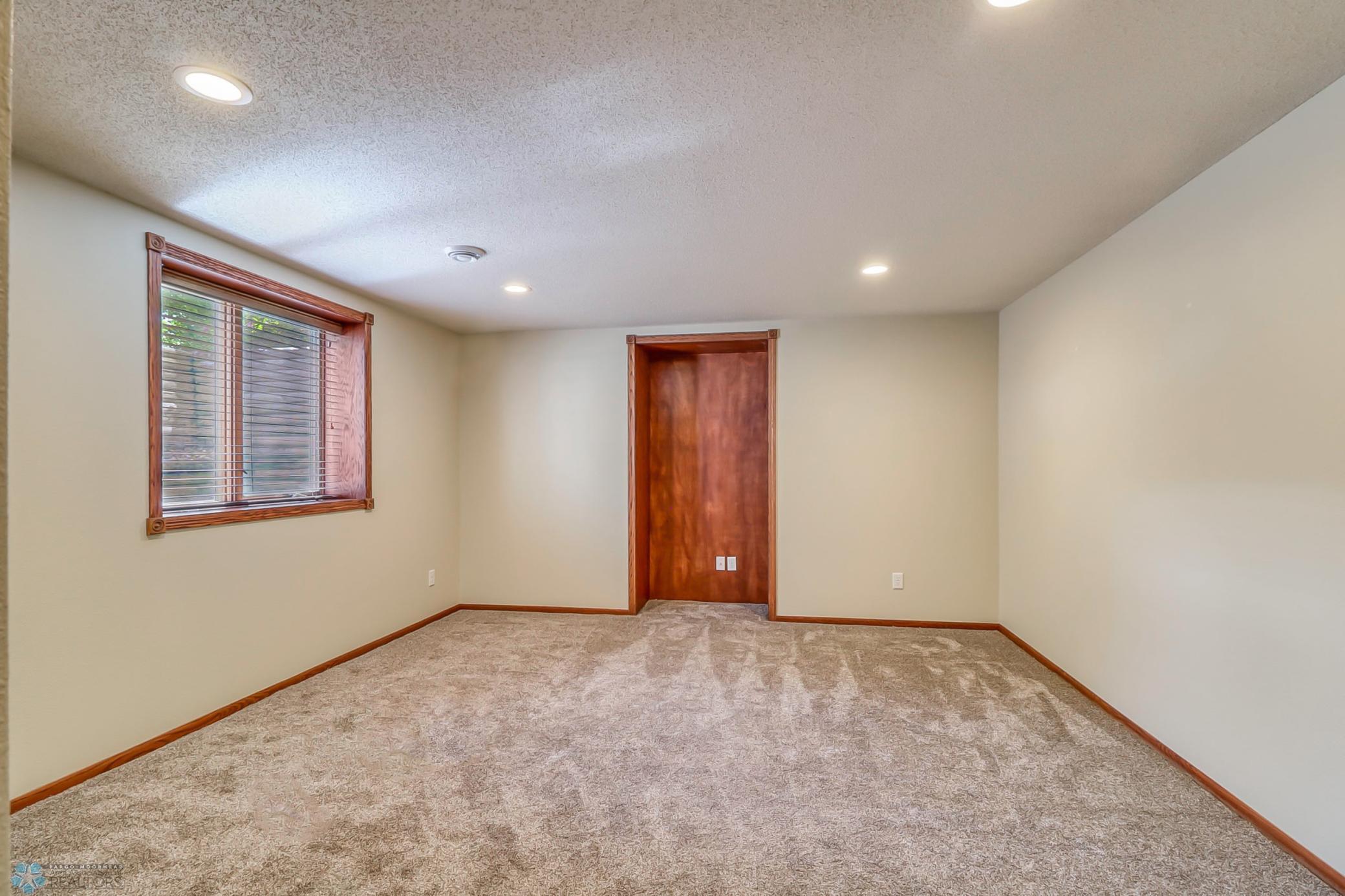 Basement Bedroom with alcove - great for future built in desk, dresser, cabinet, art -- you decide.