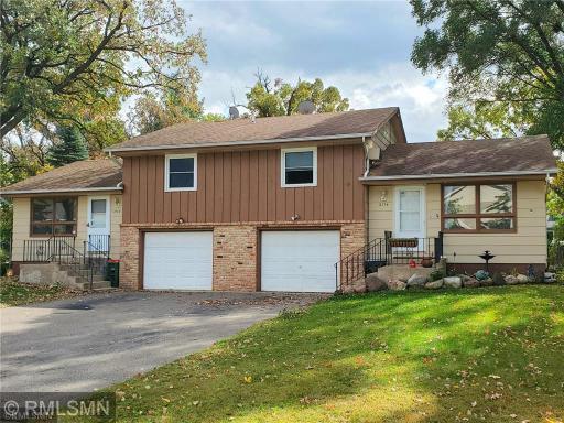 The side-by-side duplex is situated in a quiet neighborhood on a dead-end street.