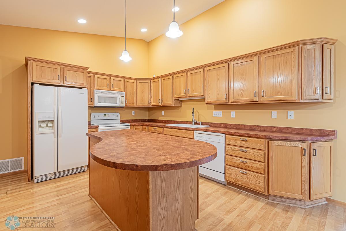 Kitchen with Island, Pantry, laminate flooring & lots of cabinetry!