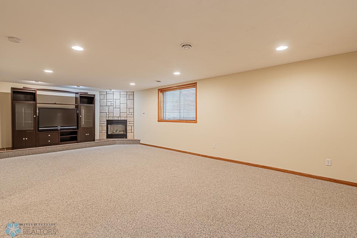 Family Room with Cozy Fireplace & newer carpet