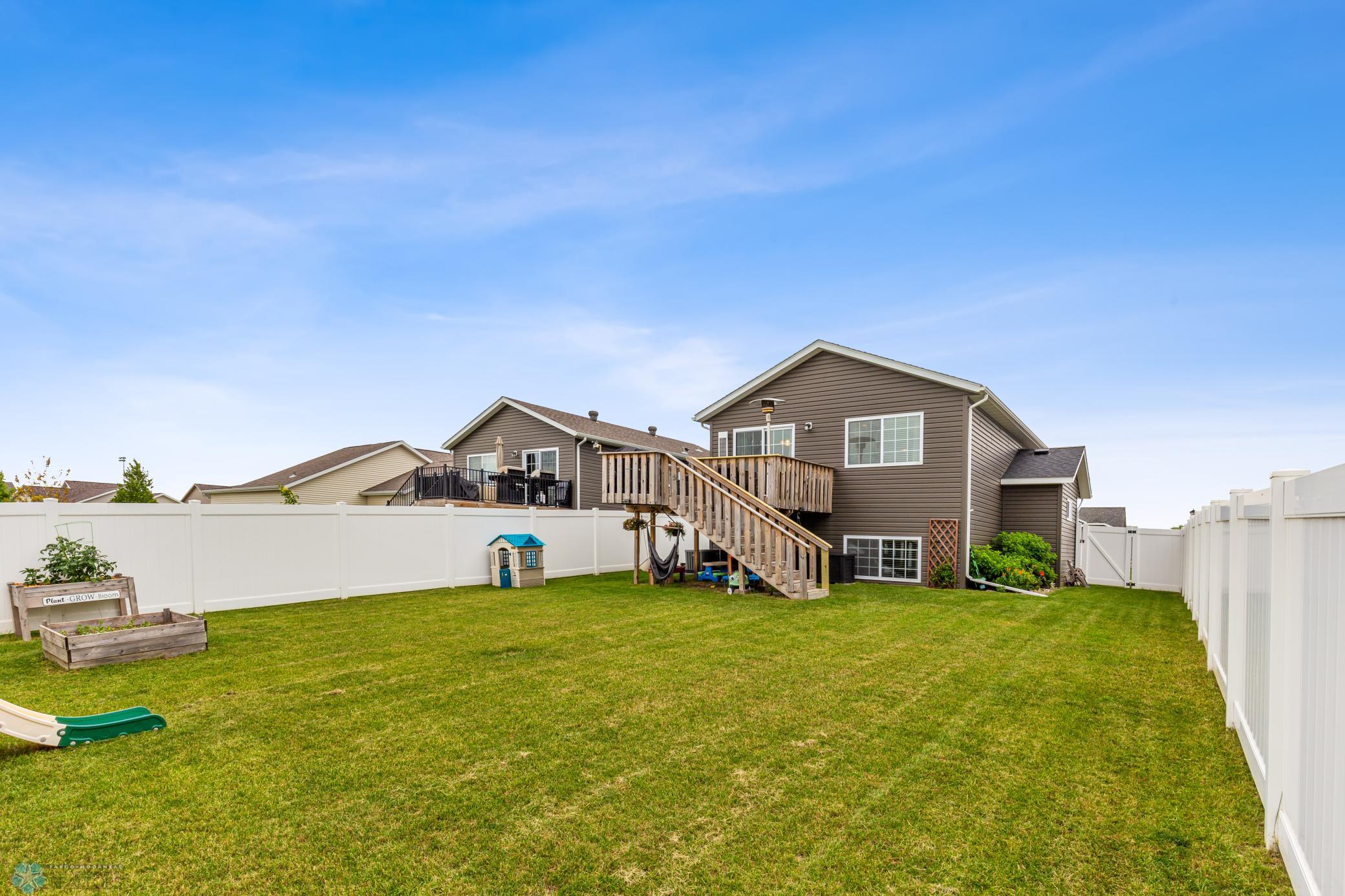 Exterior with deck and maintenance free fence