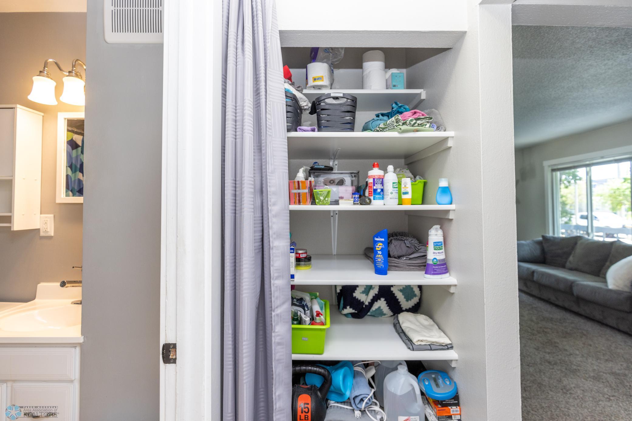 Hallway closet by bathroom