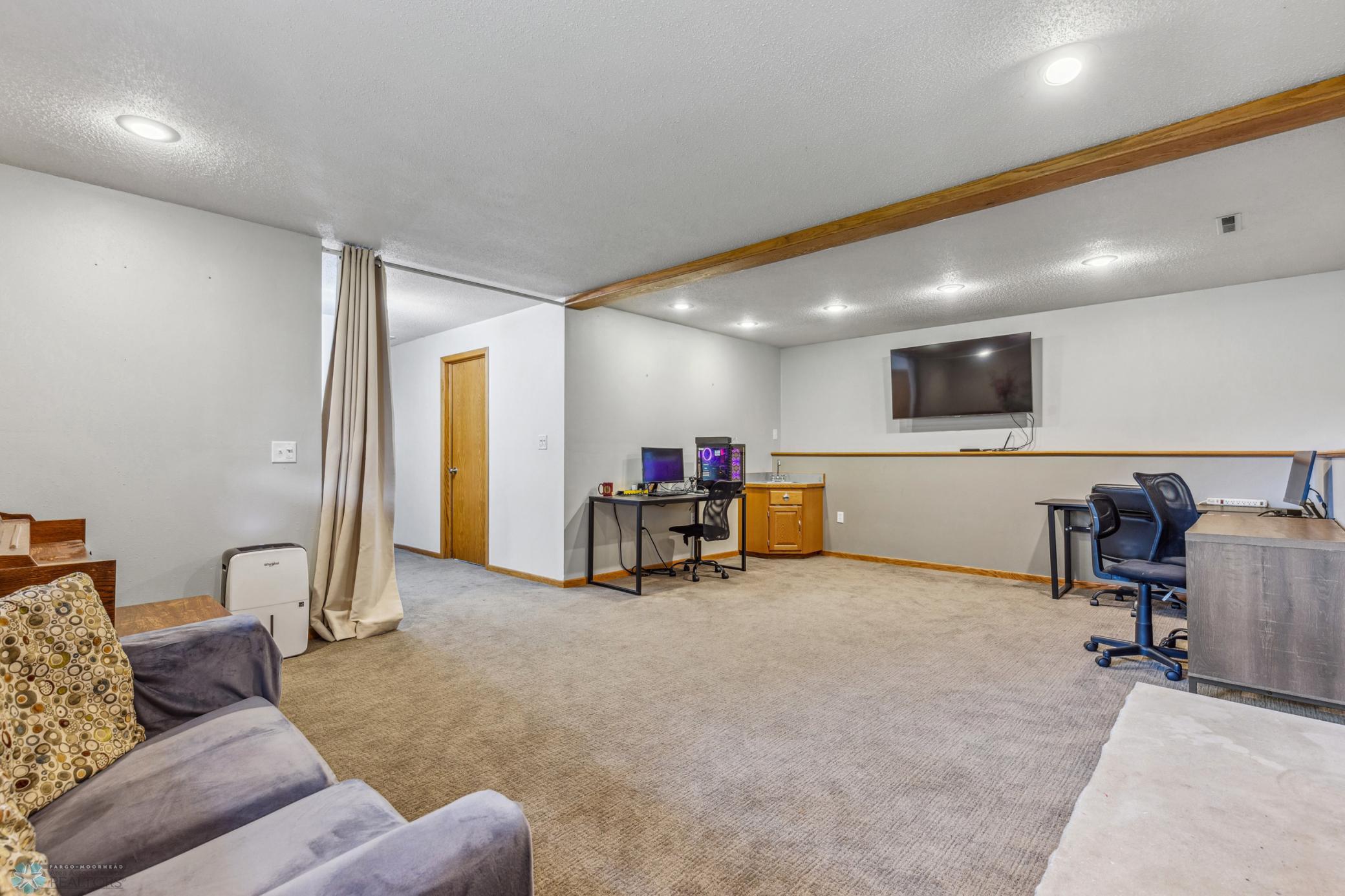 Lower Level Family Room with a bar area