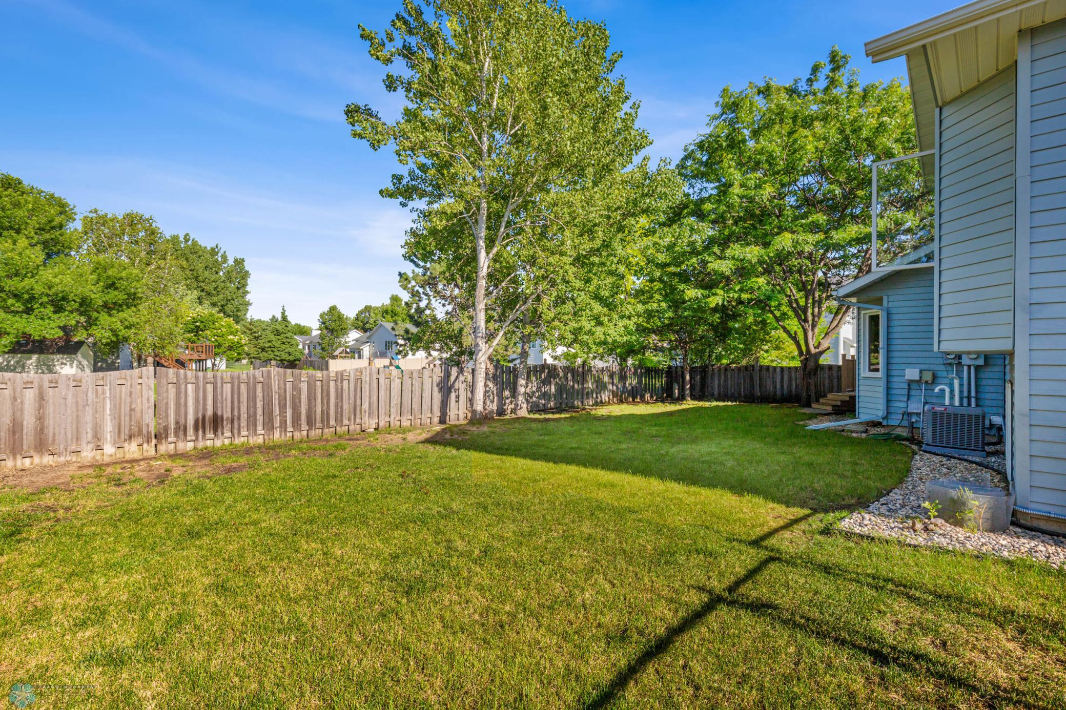 Fully Fenced Back Yard with mature trees
