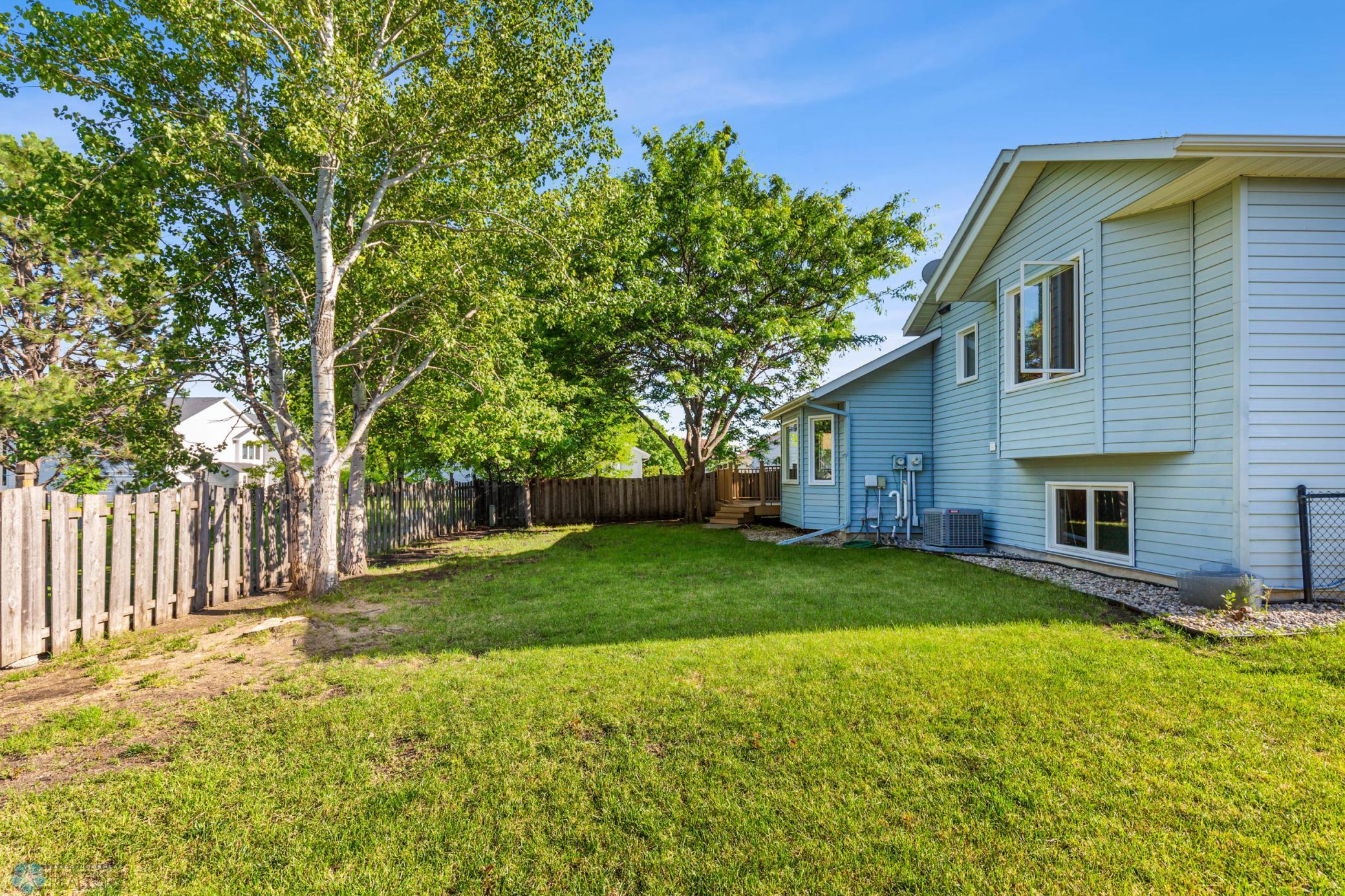 Fully Fenced Back Yard with mature trees