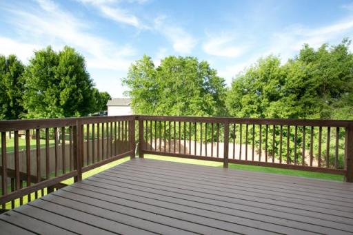 Freshly painted deck overlooking the fenced yard