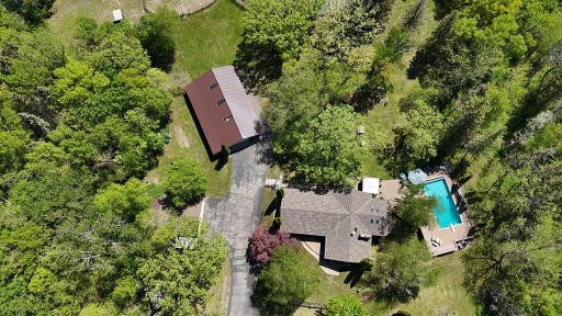 main home, pool and workshop with small barn