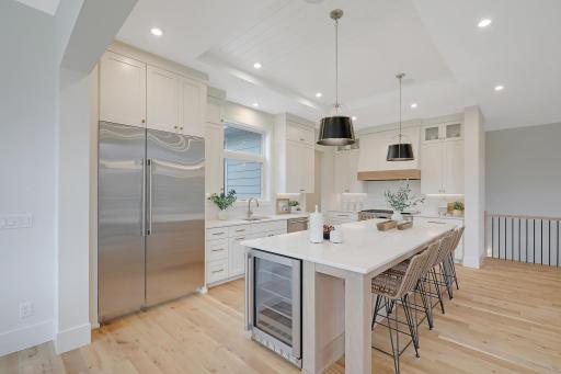 Soaring 10' ceilings, a massive center island, and space to move, create and entertain. The kitchen is a dream.
