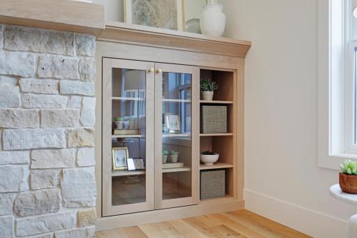 Detail of the fireplace stone and built-in bookcase.